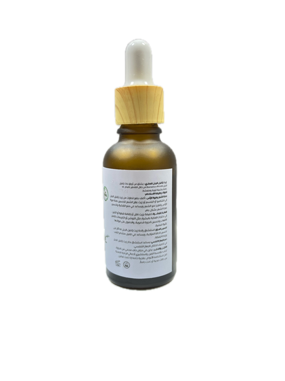 Bottle with wooden dropper on a white background